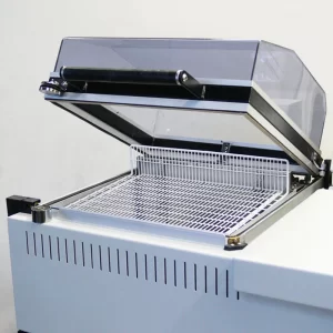 campana termoencogible con dispensador de pelicula y sellador